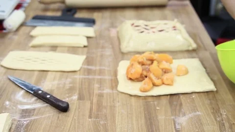 Cooking the pie, spread on the dough in sugar apricots Video stock 69993211