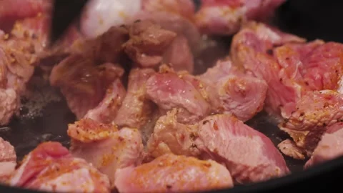 Cooking pieces of fried turkey close-up. The process of frying meat. Stock Footage 313135401
