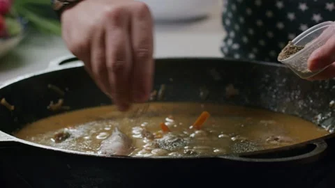 Cooking pilaf in a cauldron. Close-up Stock Footage 153392679
