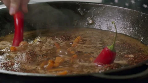 Cooking pilaf in a cauldron. Close-up Stock Footage 153392719