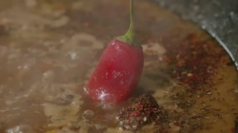 Cooking pilaf in a cauldron. Close-up Stock Footage 153392724