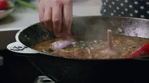 Cooking pilaf in a cauldron. Close-up Stock Footage 153392737