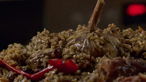 Cooking pilaf in a cauldron. Close-up Stock Footage 153392788