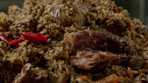 Cooking pilaf in a cauldron. Close-up Stock Footage 153392795