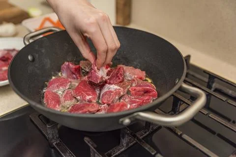 Cooking pilaf in a cauldron. A step by step recipe for cooking pilaf, cut the Stock Photos