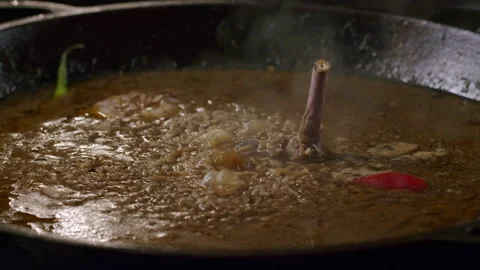 Cooking pilaf in a cauldron. timelapse Stock Footage 153392834
