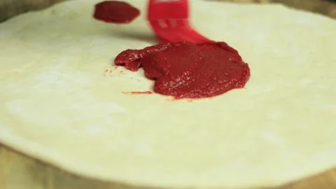 Cooking pizza adding ingredients to the pizza Video stock 146286616