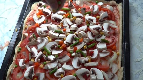 Cooking pizza. Adding vegetables. Stock Footage 84099133