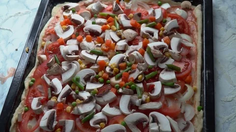Cooking pizza. Adding vegetables. Stock Footage 84099347