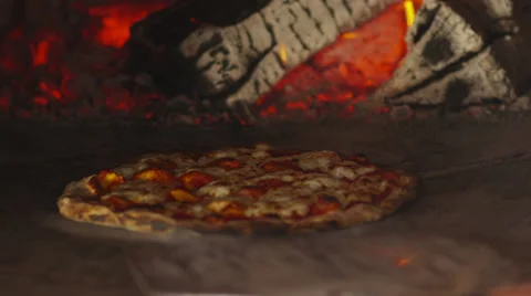 Cooking pizza in brick oven Stock Footage