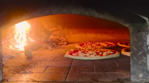Cooking Pizza. The Chef Prepares Pizza in the Restaurant kitchen. Stock Footage 243187701