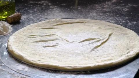 Cooking pizza. Hands adding fresh white sauce to pizza dough. Pizza ingredients Stock Footage 75057961