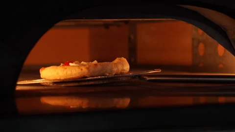 Cooking pizza in oven Stock Footage 149680956