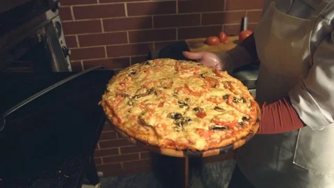 Cooking of pizza. Slow motion. Stockbeeldmateriaal 83827957