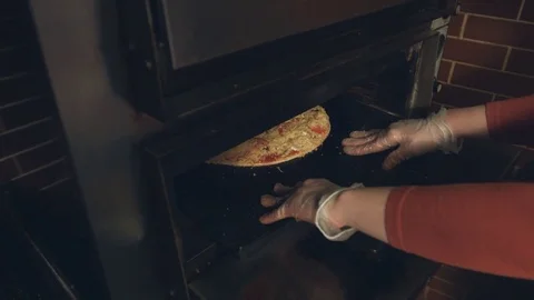 Cooking of pizza. Slow motion. Stockbeeldmateriaal 84178724