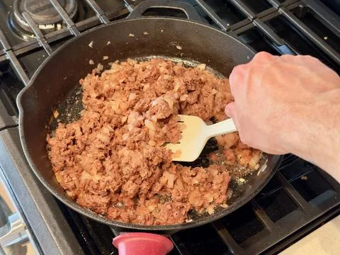 Cooking plant-based meat replacement on a gas stove Stock Photos