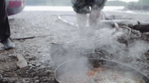Cooking a plov in a hike on a fire Stock Footage 120494471