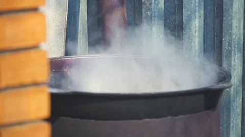 Cooking plov over an open fire Stock Footage 91196603