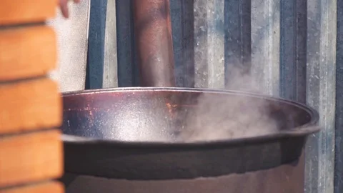 Cooking plov over an open fire Stock Footage 91196787
