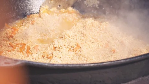 Cooking plov over an open fire Stock Footage 91196857