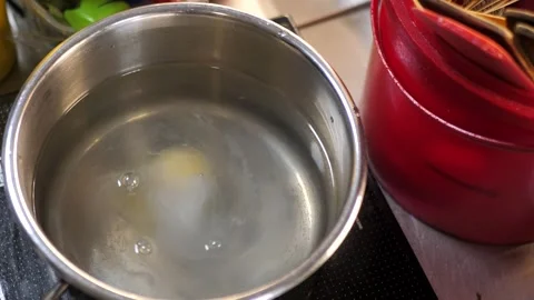 Cooking poached egg. egg in boiling water Stock Footage 283001781