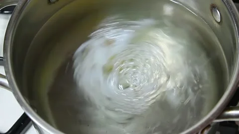 Cooking poached egg in soucepan Stock Footage 150918818