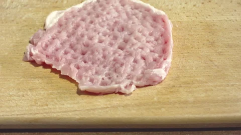 Cooking pork meat chops. Meat Tenderizer in action, close-up. 스톡 동영상 135436892