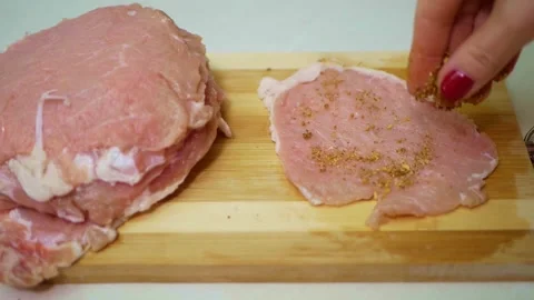 Cooking pork meat chops. Meat Tenderizer in action, close-up. Stock Footage 150666537