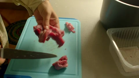 Cooking pork preparation, preparing raw pork fillets in warm kitchen Stock Footage 320955939