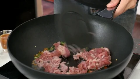 ​ cooking pork by stir fried Stock Footage 75008171