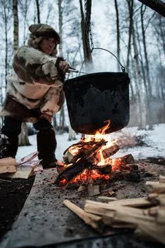 Cooking in a pot on the fire Stock Photos