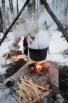 Cooking in a pot on the fire Stock Photos