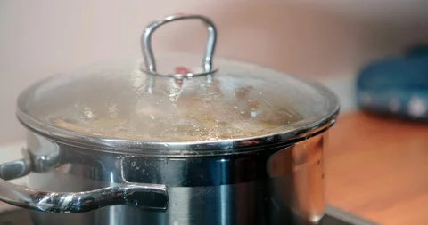 Cooking pot full of boiling water with food inside, potato. Stock Footage 123385993