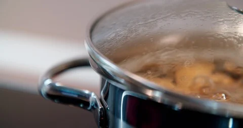 Cooking pot full of boiling water with food inside, potato. Stock Footage 123548447