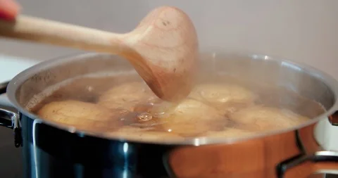 Cooking pot full of boiling water with food inside, potato. Stock Footage 123548749