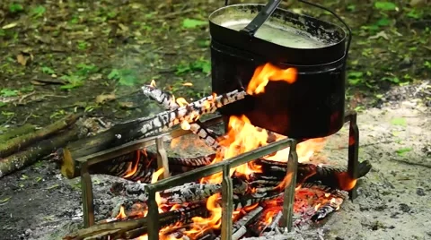 Cooking in a pot over the fire. Stock Footage 50294850