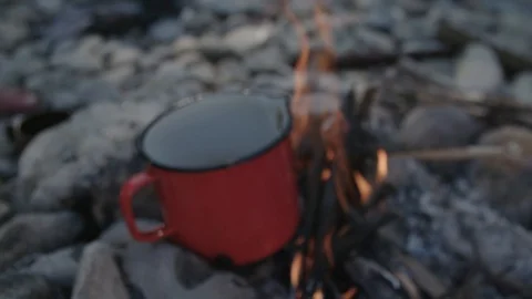 Cooking in pot on small campfire Video stock 90039239