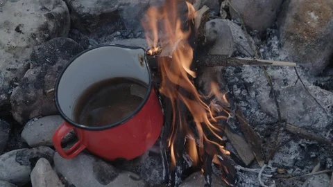 Cooking in a pot on small campfire Stockbeeldmateriaal 90040283
