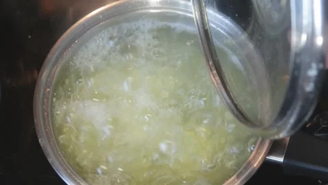 Cooking: Potatoes boiling in pan Stock Footage 278348123