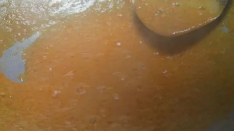 Cooking potatoes cut into small pieces with balado seasoning in a frying pan Stock Footage 304729308