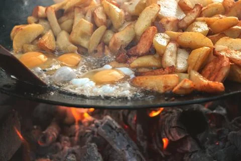 Cooking potatoes with eggs Stock Photos