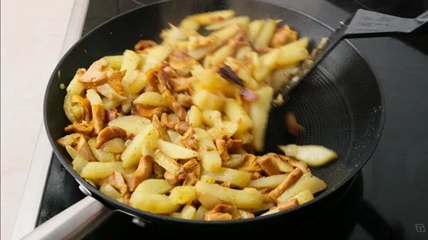 Cooking potatoes fried with chanterelles Stock Footage 314993200