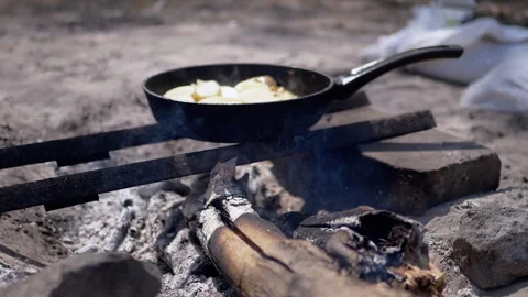 Cooking Potatoes over Campfire Video stock 293259062