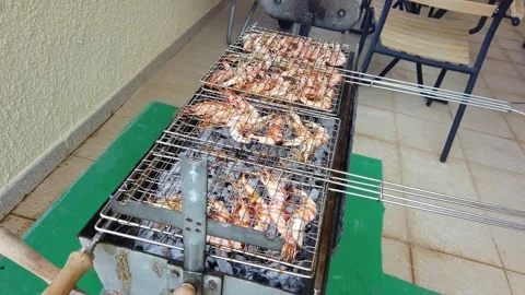 Cooking Prawns on BBQ Grill Stockbeeldmateriaal 332815772