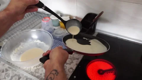 Cooking: Preparing crepes pancake in the kitchen Stock Footage 219613901