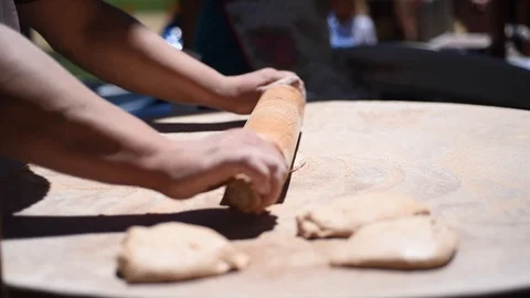 Cooking process of Armenian bread lavash. Baker kneading dough with rolling pin  Stock-Footage 92045417