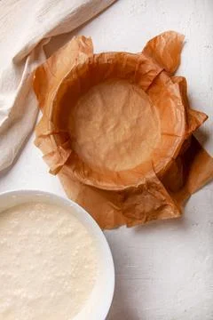 Cooking process Basque burnt cheesecake. The dough is poured into a baking Stock Photos