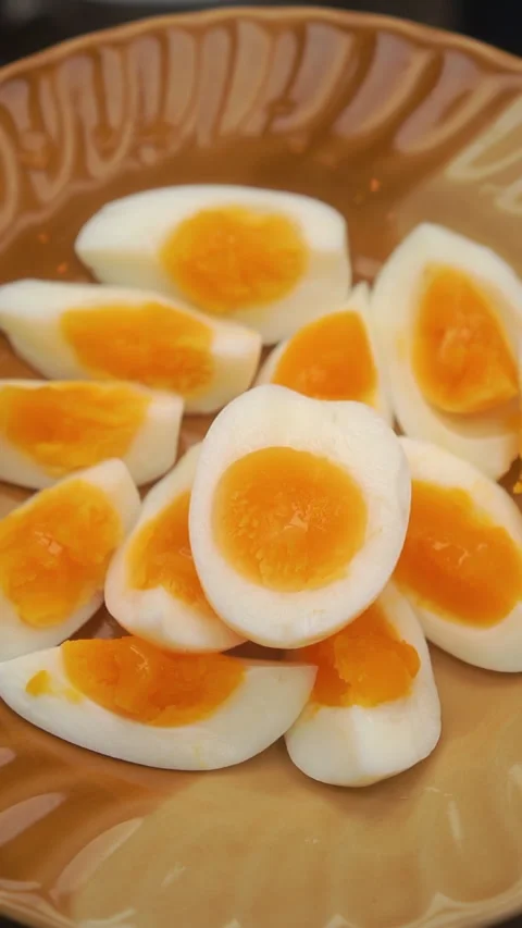 Cooking process: boiling fresh eggs in hot water, peeling, and serving medium-bo 動画素材 342612475