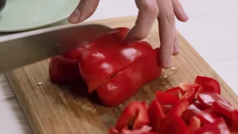 Cooking process. Cutting red sweet paprika pepper on the cutting b Stock Footage 150305906