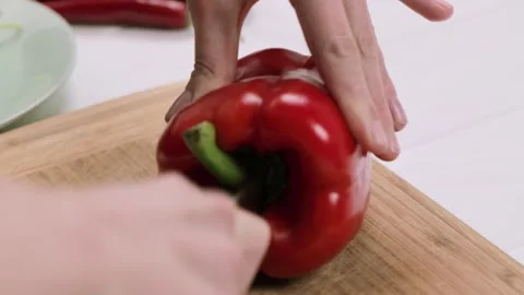 Cooking process. Cutting red sweet paprika pepper on the cutting b Stock-Footage 150305988